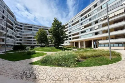 an apartment building with a courtyard in front of it at Claudias flat by DomusDimore in Rome