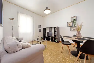 a living room with a couch and a table at Micheles Flat by DomusDimore in Rome