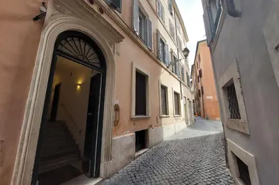 an alley with an entrance to a building at Piazza Venezia Apartment in Rome