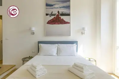 a bedroom with a bed with two towels on it at C M Il Passetto di Borgo Pio in Rome