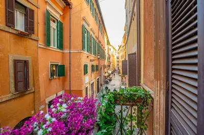 a view of an alley with flowers and buildings at Easybnb - Bear Home in Rome