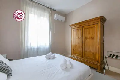 a bedroom with a bed with white towels on it at C M Piazza Cavour Elegant Flat in Rome