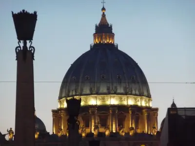 a dome of a building with a tower on top at Nido Degli Angeli in Rome