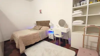 a bedroom with a bed and a sink and a mirror at La Dolce Vita in Rome