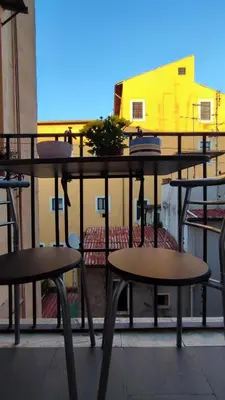 a group of tables and chairs on a balcony at La Dolce Vita in Rome