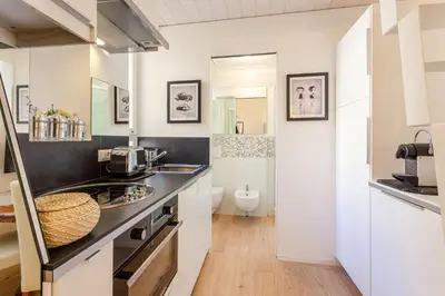 a bathroom with a sink and a toilet at La Casa Di Teo in Rome