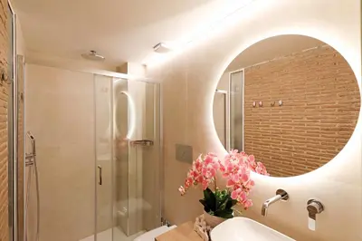 a bathroom with a sink and a mirror at Vatican Loft - Liberty Collection in Rome