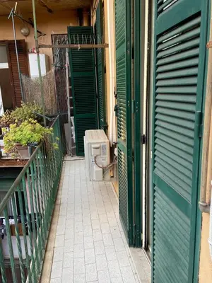 an open door of a house with a toilet on a porch at Domus Alexandra in Rome