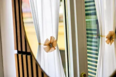 a close up of a window with white curtains at Coppedè Lovely Apartment in Rome