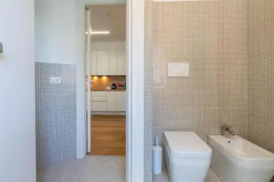 a bathroom with a toilet and a sink at Apartment Valle Aurelia Metro in Rome