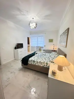 a large bedroom with a bed and a desk at Casa Giulia in Rome