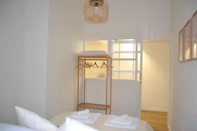 a room with a bed with a shelf and a window at Cozy hideaway in Trastevere in Rome