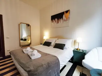 a bedroom with a large bed with towels on it at Key apartments Vatican Flat in Rome