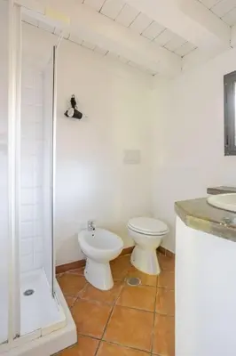 a bathroom with a toilet and a shower and a sink at Minicasa Vatican in Rome