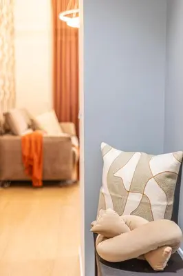 a living room with a couch and a chair at Vatican Modern Apartment 5 min Metro A - Terrestre in Rome