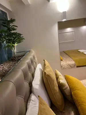 a living room with a couch and a mirror at Historical Houses in Rome