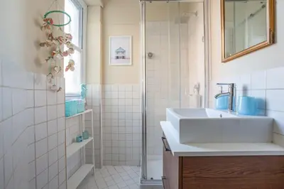 a bathroom with a sink and a shower at Roma is amoR in Rome