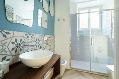 a bathroom with a white sink and a shower at YCH-Belle Epoque House in Rome