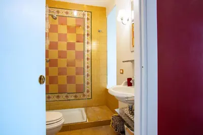 a bathroom with a toilet and a shower and a sink at Il sogno delle tartarughe in Rome
