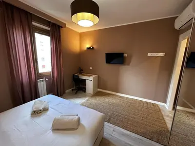 a bedroom with a bed with two towels on it at Provincie 55 in Rome