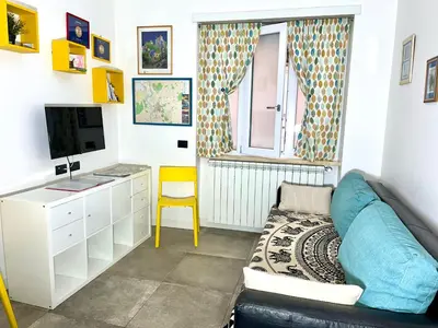 a living room with a couch and a tv at Interno Sette in Rome