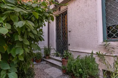 an open door of a house with potted plants at BelleArtiHome2 in Rome