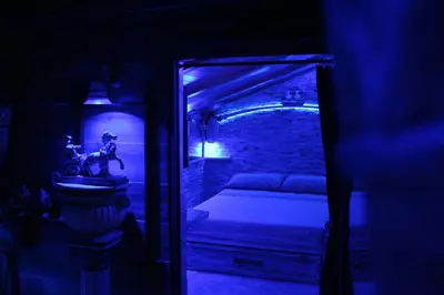 a room with a bedroom with a bed and a mirror at Domus Corneliæ - Romantico Attico Roman & Jacuzzi - Metro A Cornelia in Rome