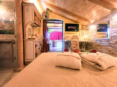 a bedroom with a large bed in a room at Domus Corneliæ - Romantico Attico Roman & Jacuzzi - Metro A Cornelia in Rome