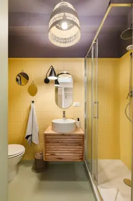 a bathroom with a toilet and a sink and a mirror at casa pinolo in Rome