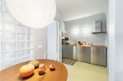 a kitchen with a wooden table with fruit on it at casa pinolo in Rome