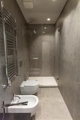 a bathroom with a toilet and a sink and a shower at Castroni Ottaviano Suite in Rome