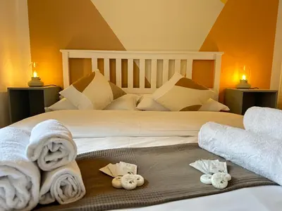 a bedroom with a bed with towels on it at Angolo al Vignola in Rome