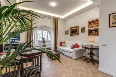 a living room with a couch and a table at Belle Arti Home in Rome