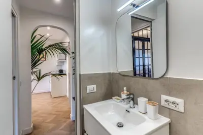 a bathroom with a sink and a mirror at Belle Arti Home in Rome
