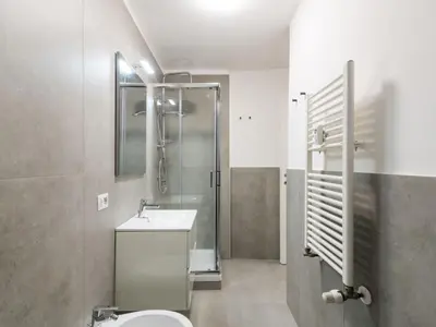 a bathroom with a toilet and a shower and a sink at Apartment Welcome Rome by Interhome in Rome