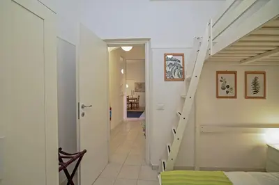 a hallway with a staircase in a house at Lucia Casa Vacanze Ponte Milvio in Rome