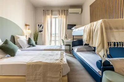 a bedroom with two beds and a bunk bed at Dafne Rooms a relaxing piece of paradise in Rome