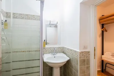 a bathroom with a sink and a shower at My Tiny Home Alchemy in Rome