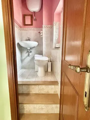 a bathroom with a toilet and a sink at Angolo dè Trastevere - Accogliente e silenzioso in Rome