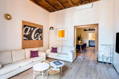 a living room with a couch and a table at ROMAC Baullari II 4bdr near Campo de Fiori in Rome