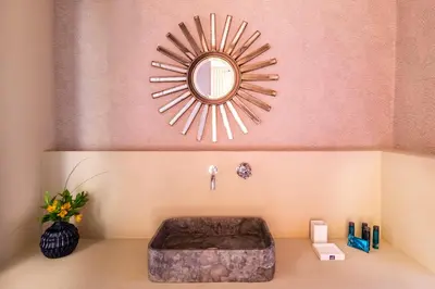 a bathroom with a large mirror and a tub at ROMAC Baullari II 4bdr near Campo de Fiori in Rome