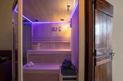 a purple lighted walk in shower in a room at ROMAC Baullari II 4bdr near Campo de Fiori in Rome