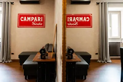 a restaurant with two signs on the wall and a table at Caffarella Suite in Rome