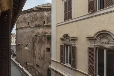a side view of a building next to a window at HC - Live Roma Pantheon View in Rome