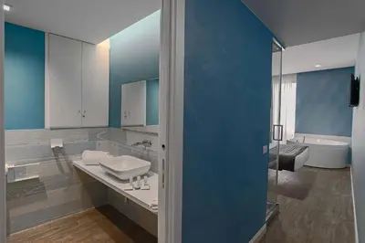 a bathroom with a sink and a bath tub at Ripetta Relais in Rome