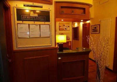 a room with a bar with a lamp and a sign at 69 Manin Termini in Rome
