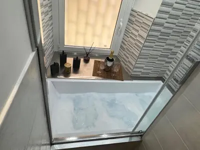 a view of a window with a pool of water at Stelletta Apartment in Rome