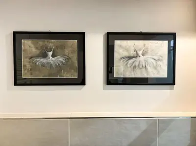 two framed pictures of birds on a wall at Stelletta Apartment in Rome