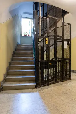 a staircase in a building with a metal gate at Vatican 44 in Rome