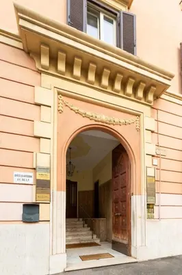 an entrance to a building with a wooden door at Vatican 44 in Rome